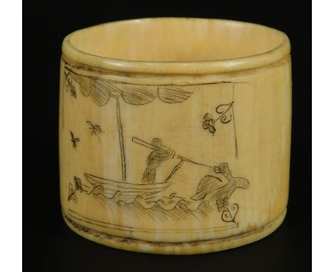 Scrimshaw. A 19thC ivory napkin ring, incised with a whaling scene with birds etc, 4.5cm diameter. 