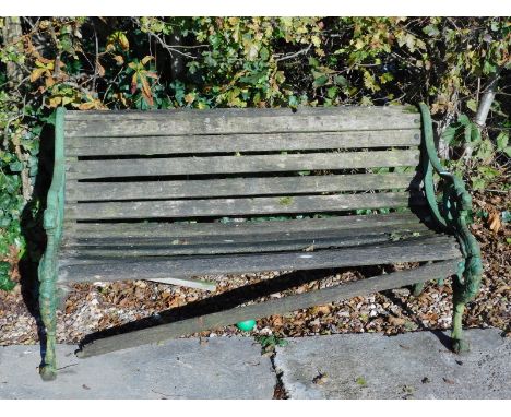 A Coalbrookdale style cast iron and wooden slatted garden bench.
