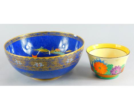 A Clarice Cliff Bizarre Gay Day pattern sugar bowl, 13cm diameter, and a Carltonware Bleu Royale Mikado style bowl. (2, each 