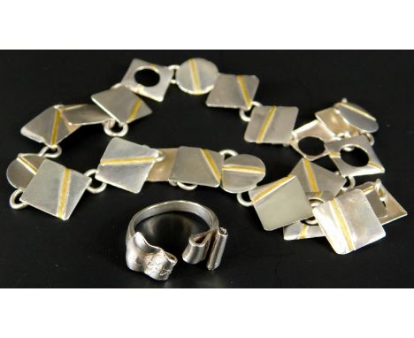 A modern necklace and ring, the necklace formed with squares and circles, white metal, unmarked, and a dress ring, of scroll 