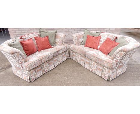 A pair of modern sofas, each with a canted back, upholstered in tapestry style printed fabric. Purchased from House of Shah L
