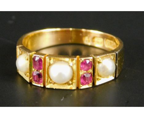 A Victorian 15ct gold dress ring, set with garnet and seed pearl, 2.4g all in.