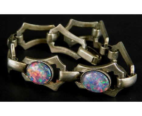 A silver plated bracelet, of Art Nouveau style, set with two opal type stones.