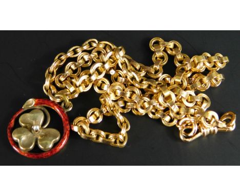A clover pendant and chain, the pendant with a three leaf clover, and central seed pearl, surrounded by red enamel, on a gold