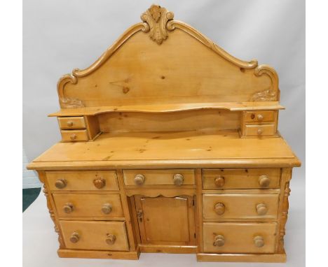 A Lincolnshire type Victorian pine dresser, the raised back with two frieze drawers and a shaped shelf, the base with an arra