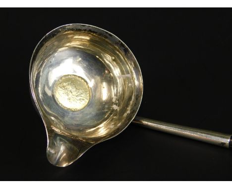 A late 18th/early 19thC silver toddy ladle, inset with a 1787 gilt coin, with whale bone handle, marks indistinct