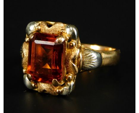 An 18ct gold dress ring, with central rectangular citrine, surrounded by bi-colour design, 5.7g all in. 