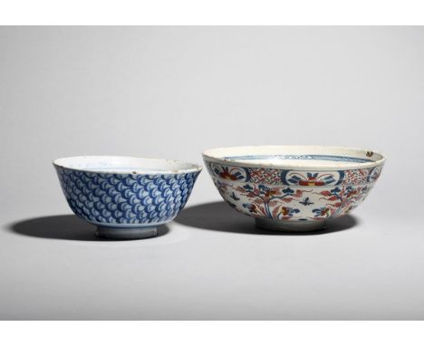Two delftware bowls  c.1730-50, the smaller painted in blue to the exterior with overlapping scales, raised on a slightly fla
