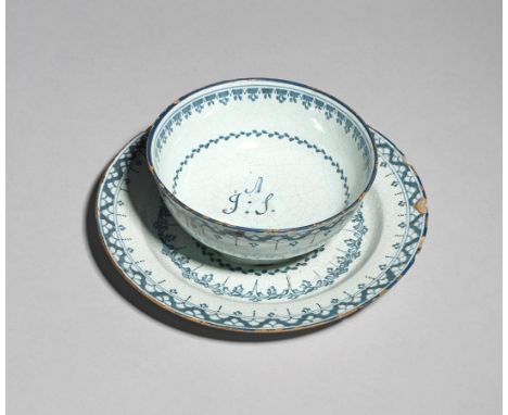 A rare Lambeth delftware butter bowl or sweetmeat dish  c.1770-80, the small bowl affixed to a plate or stand, decorated with