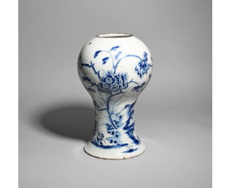 A massive delftware vase  c.1760, probably Liverpool, the baluster form painted in blue with a large spray of flowering peony