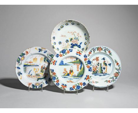 Two Lambeth delftware plates  c.1740, both painted in red, yellow, green and blue, one with a seated Chinese boy between flow