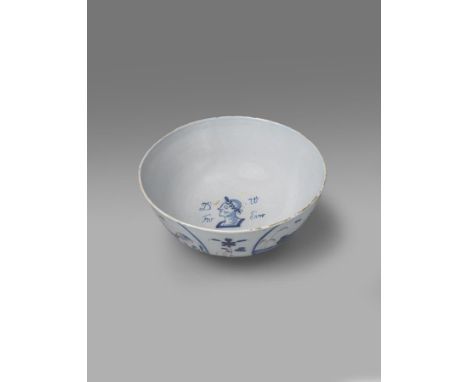 A Bristol delftware punchbowl of Jacobite relevance  c.1746, painted in blue to the interior with the profile portrait of the