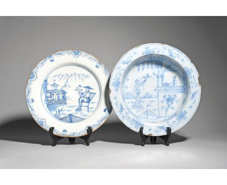 A large delftware shallow bowl and a charger  c.1740-60, the bowl of large size and painted in blue with a Chinese lady looki