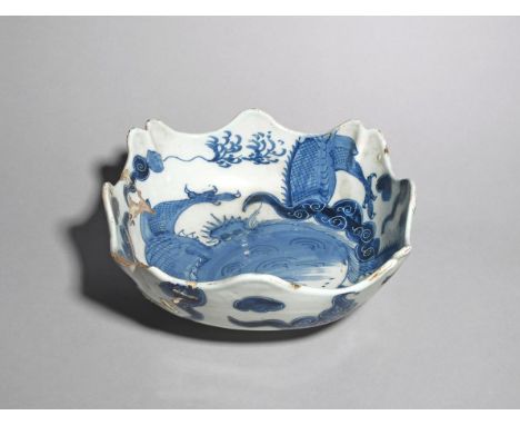 A rare delftware square bowl  c.1770, of unusual lobed square shape with undulating rim, boldly painted in blue to both sides