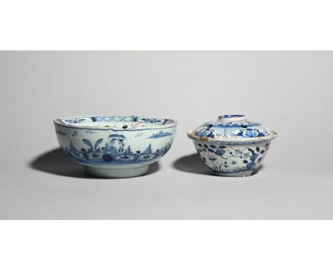 A delftware flower bowl  c.1700-20, of circular form, painted in blue with insects in flight around flowering plants, the fix
