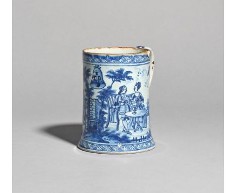 A delftware glass-bottomed mug  c.1780-85, painted in blue with a maid pouring tea for a couple seated in a garden, the other