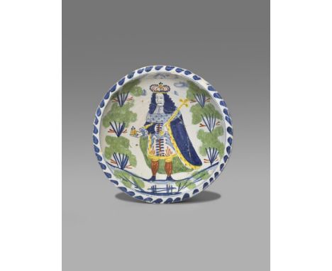 A Bristol delftware blue dash Royal charger  c.1714-27, painted with a full length portrait of George I or George II, holding