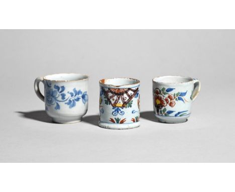Two delftware coffee cups and a small mug or can  c.1750-90, the can probably Lambeth and painted in the Ann Gomm manner with