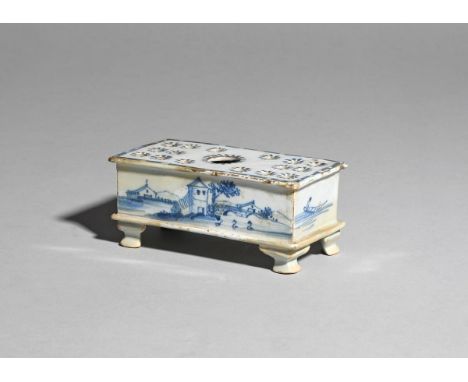 An unusual small delftware flower brick  c.1760, probably Liverpool, the shallow rectangular form painted in blue to the long
