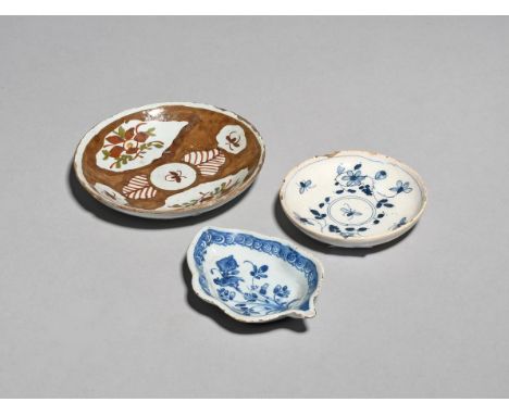 A delftware pickle dish  c.1740-50, of leaf shape, painted in blue with a bird perched atop flowering branches, within a scro