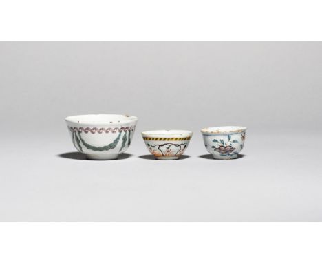 Two delftware miniature teabowls  c.1760, one painted in polychrome enamels with Oriental flower sprays, the other with styli