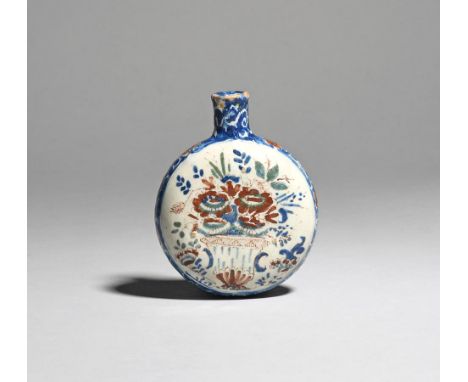 A small delftware spirit flask  c.1730-50, probably English, the flattened circular form painted in blue, green and red, one 