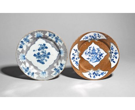 Two delftware powdered ground plates  c.1740-50, one probably Lambeth and painted in blue with a pagoda issuing from rockwork