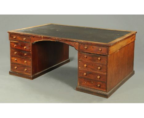 A Victorian mahogany partners desk, with leatherette writing surface, crossbanded edge and fitted with frieze drawers and fou