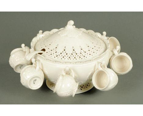 A Hartley Greens & Co. Leeds Pottery punch bowl, with lid, ladle and eight cups.  Diameter 30 cm. 