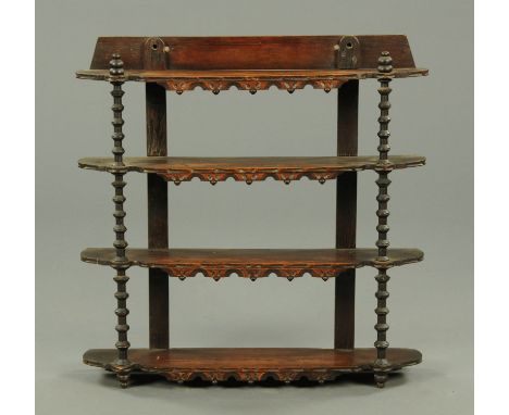 A 19th century ebonised three tier open shelf unit.  Width 79 cm. 