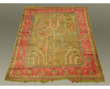 A Turkish carpet, principal colours green, blue, red and beige.  +/- 310 cm x 260 cm.    CONDITION REPORT:  In our opinion th