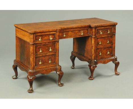 A Victorian walnut pedestal desk, one drawer stamped "Old Times furnishings Company, Westminster", with inverted breakfront, 