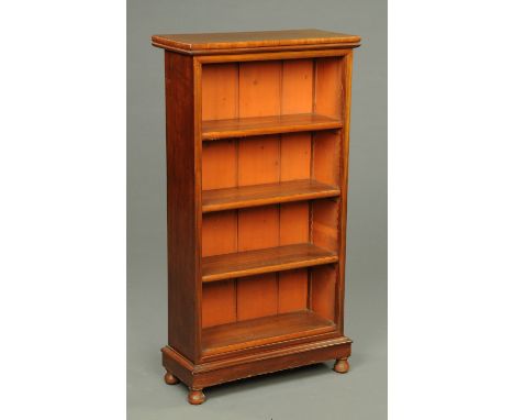 A late Victorian mahogany open bookcase, with adjustable shelves and raised on short bun feet.  Width 61 cm.    CONDITION REP