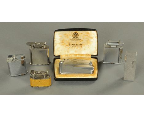 A Dunhill vintage cigarette lighter, and five others. 