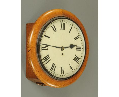 A 19th century single fusee wall clock, the enamelled dial with Roman numerals and eight day movement in oak case.  Dial diam