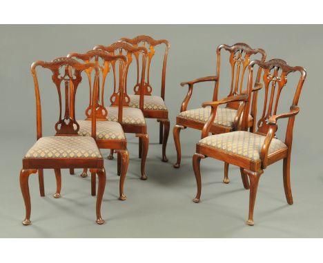 A set of two carver arm and four single Edwardian mahogany Chippendale style dining chairs, each with drop in seat and raised