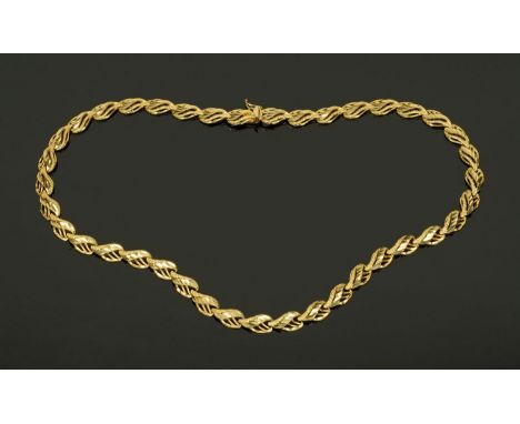 A gold coloured metal necklace, stamped "14 k", 25.5 grams (see illustration). 