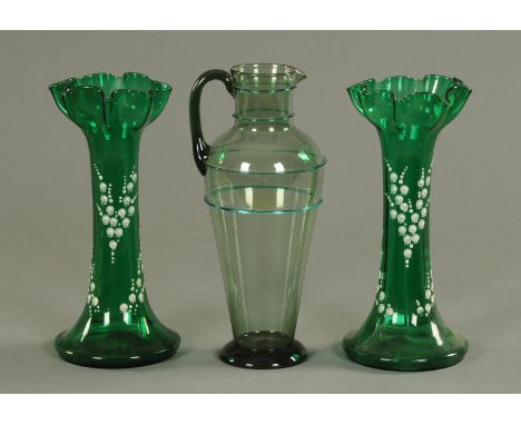 A pair of Bristol green glass vases, 19th century, with wavy flaring rims and enamel lily of the valley decoration and a Whit