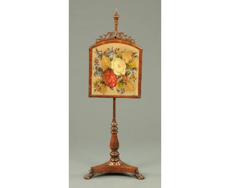 A William IV rosewood fire screen, with bead and woolwork foliate panel, turned column and triform base. 