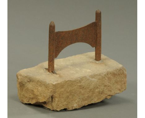 Two sandstone gate post tops, height 48 cm, and a boot scraper. 
