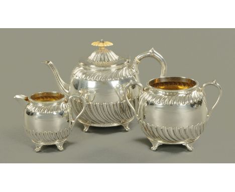 An Edwardian silver plated three piece tea service, with half lobed body.