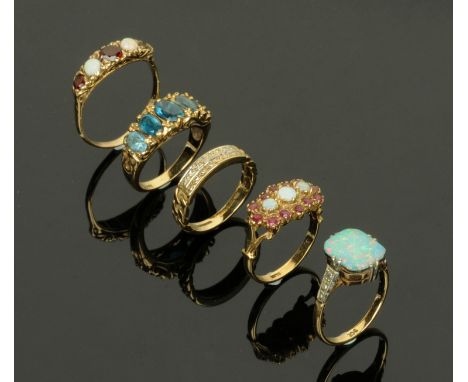 Five 9 ct gold dress rings, one set with a rectangular opal, two set with opals and garnets, and two others, 15.7 grams gross