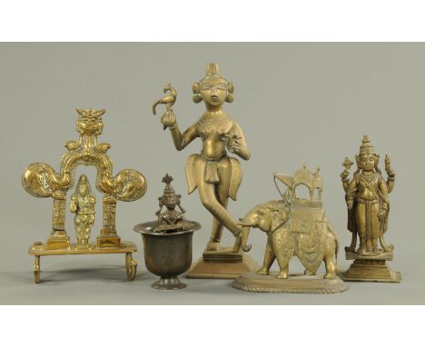 Indian metal wares, 19th century, to include figures of Lakshmi and Vishnu, and a brass model of a caparisoned elephant with 