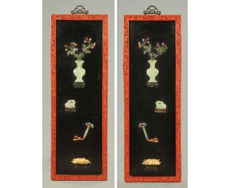 A pair of Chinese applique panels, 20th century, each with carved jade and soapstone vase with flowers above a recumbent deer