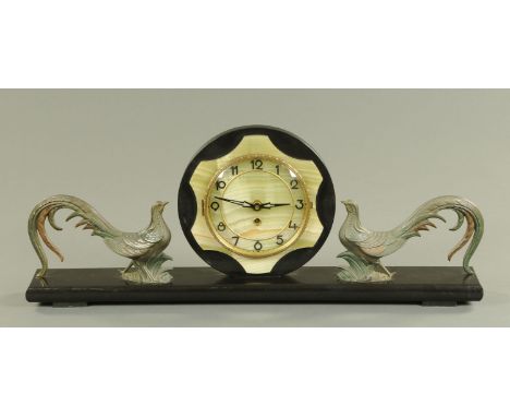 A French Art Deco black slate and onyx mantle clock, circa 1920's/30's, the onyx and black slate clock face with Arabic numer