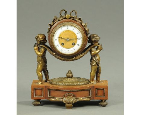 An Edwardian mantle clock, with French movement, the dial marked "Sopley, Glasgow", with two-train striking movement, brass c