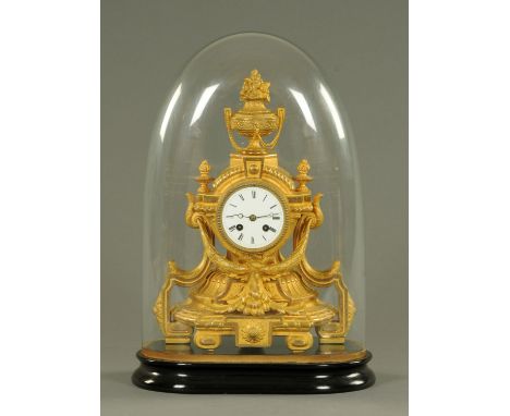 A Victorian spelter mantle clock, in the classical style with urn and cover finial and two-train striking movement housed und