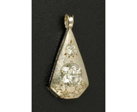 A white coloured metal diamond set pendant.  15 mm x 9 mm.   CONDITION REPORT:  The back of the pendant is rounded in the sam