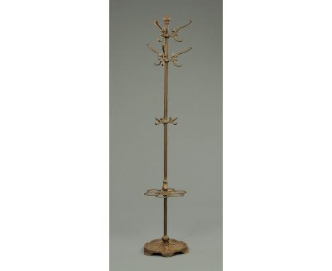A cast iron hat and coat stand, with stick apertures and drip tray.  