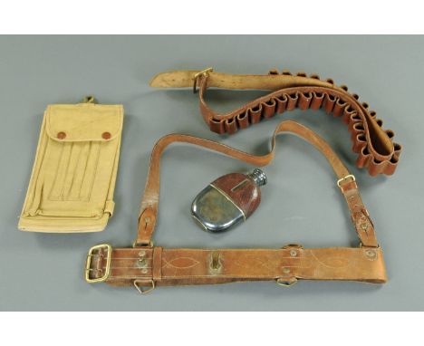 A military Sam Browne belt by Wilkinson, an ammunition belt, map case and flask.  